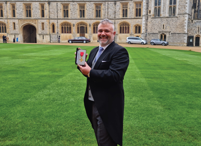 Barnsley College’s Principal and CEO, Yiannis Koursis OBE, receiving his Officer of the Order of the British Empire (OBE) Honour by His Majesty King Charles III at Windsor Castle.